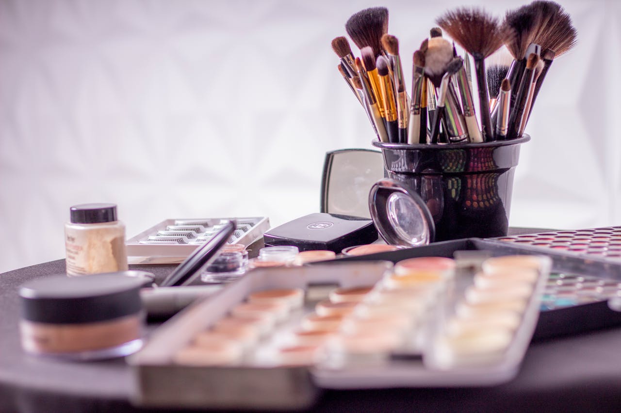 Mastering the First Impression: Your intriguing post title goes here Close-up of a professional makeup brush set and cosmetics on a table for beauty use.
